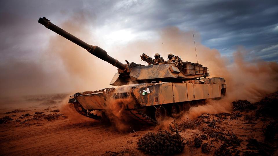 Marines from 4th Tank Division, Twentynine Palms, Calif., roll down a dirt road on their M1A1 Abrams Main Battle Tank during a day of training at Exercise Africa Lion 2012, April 13, 2012.