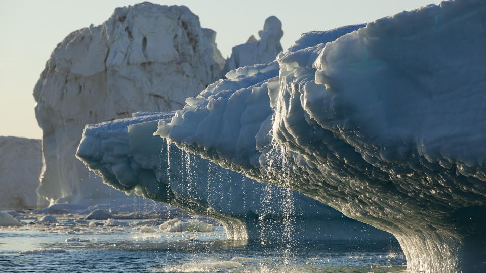  Melting ice pours off the tip of an ice sheet. 