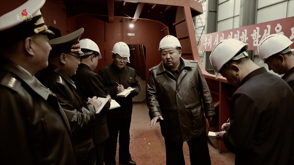 Kim is pictured visiting the new warship under construction, likely in October or some time after. <em>KCNA</em>