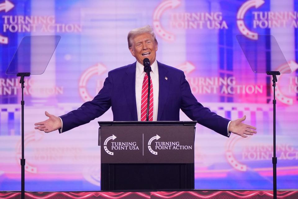 President-elect Donald Trump addresses the conservative AmericaFest conference on Dec. 22, 2024, in Phoenix.