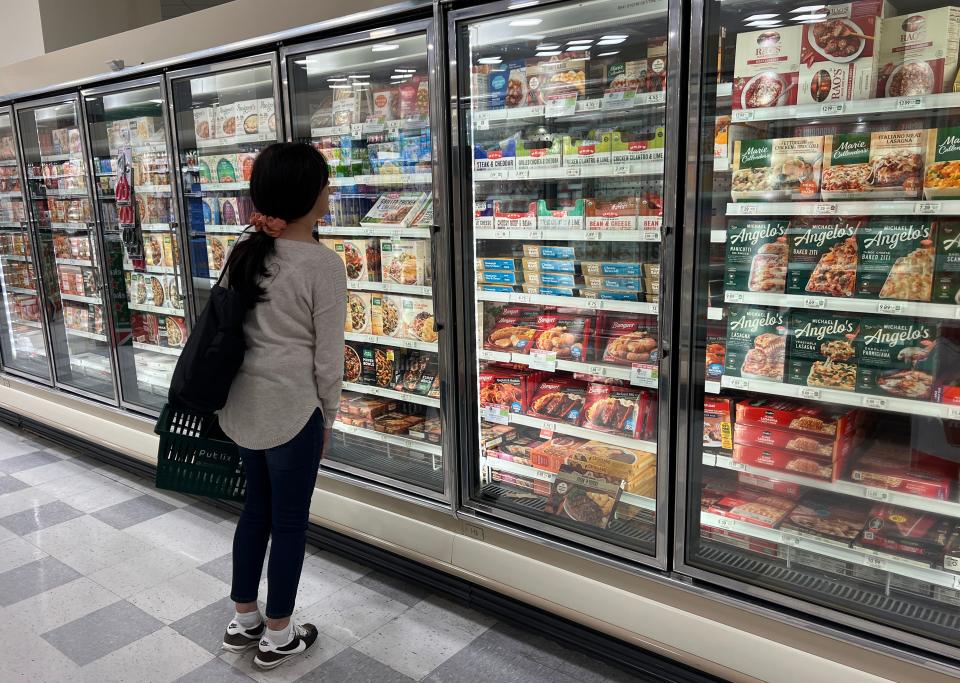 A customer shops in the ready to eat meals aisle of a grocery store on October 17, 2024 in Miami, Florida.