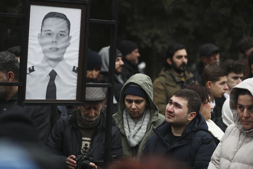 Mourners at the funeral of First Officer Aleksandr Kalyaninov in Baku, 29 December, 2024
