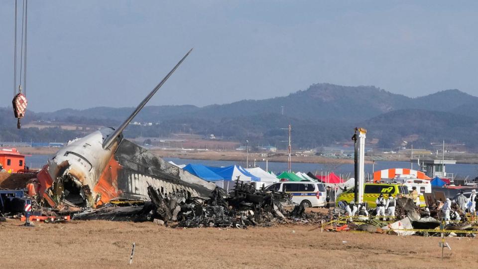 PHOTO: Rescue team members work at the site of a plane fire at Muan International Airport in Muan, South Korea, Dec. 30, 2024. (Ahn Young-joon/AP)