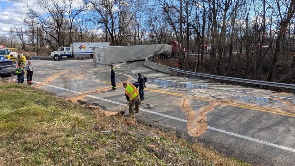 18-wheeler overturns, spilling corn syrup substance