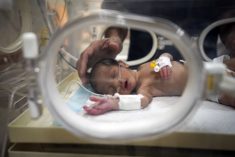 Ali al-Batran, a 20-day-old infant, lies in the intensive care unit at Al-Aqsa Martyrs Hospital in Deir al-Balah, 29 December, 2024