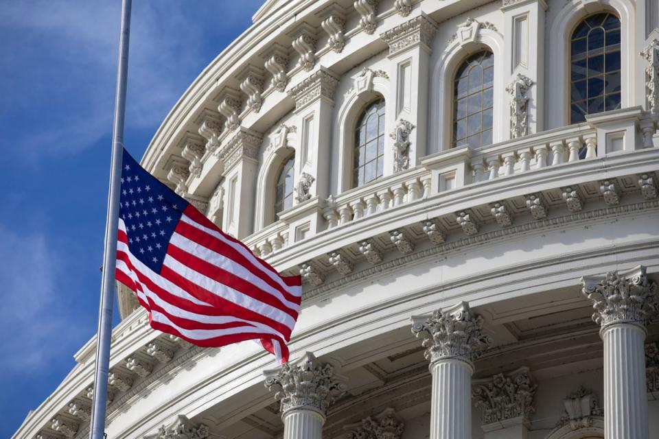 The US flag flies at half-staff in honor of former President George HW Bush outside the US Capitol in Washington, DC on 3 December, 2018 (AFP via Getty Images)
