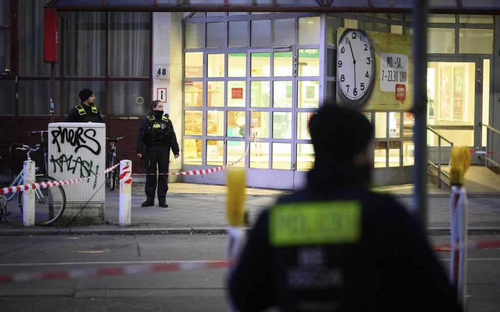 Berlin police say they have detained a man who attacked two people with a knife