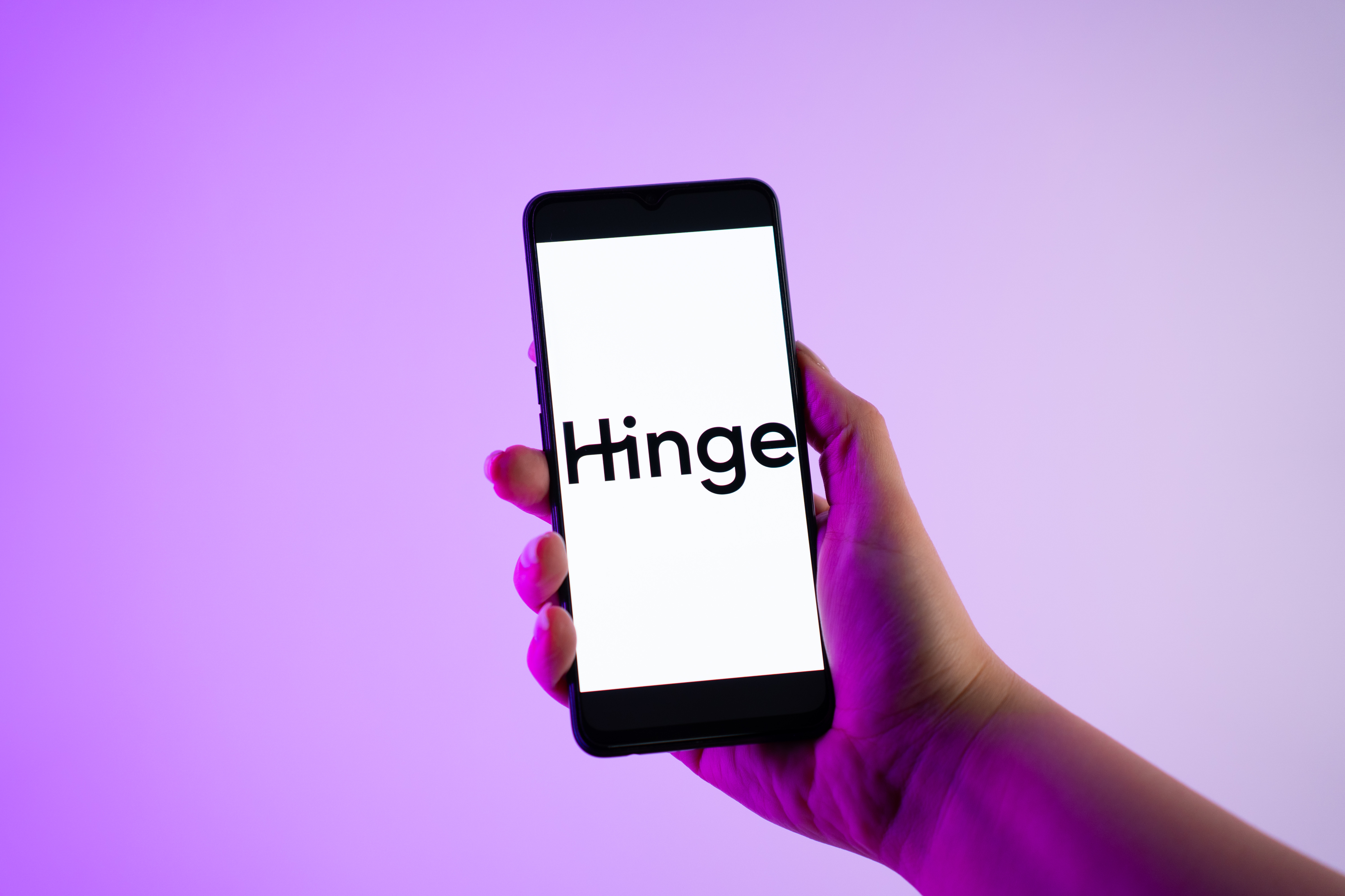 Hinge dating app logo on phone.