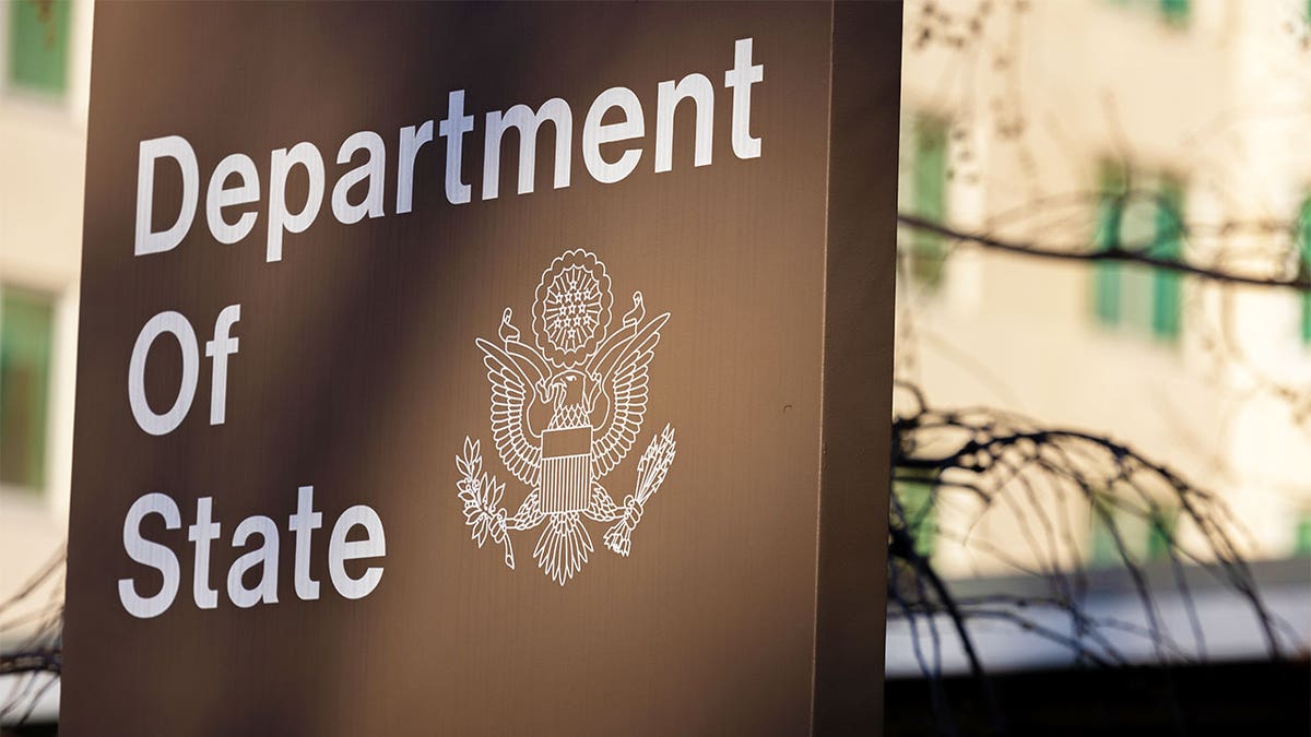 A sign outside the State Department building