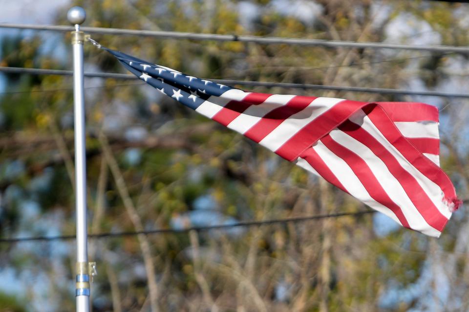 A damaged flag flaps in the wind in Pike Road, Ala., on Sunday December 29, 2024.