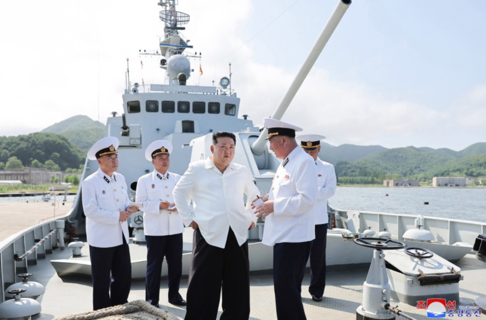 Kim observes a missile firing drill from aboard a North Korean patrol boat. <em>KCNA</em>