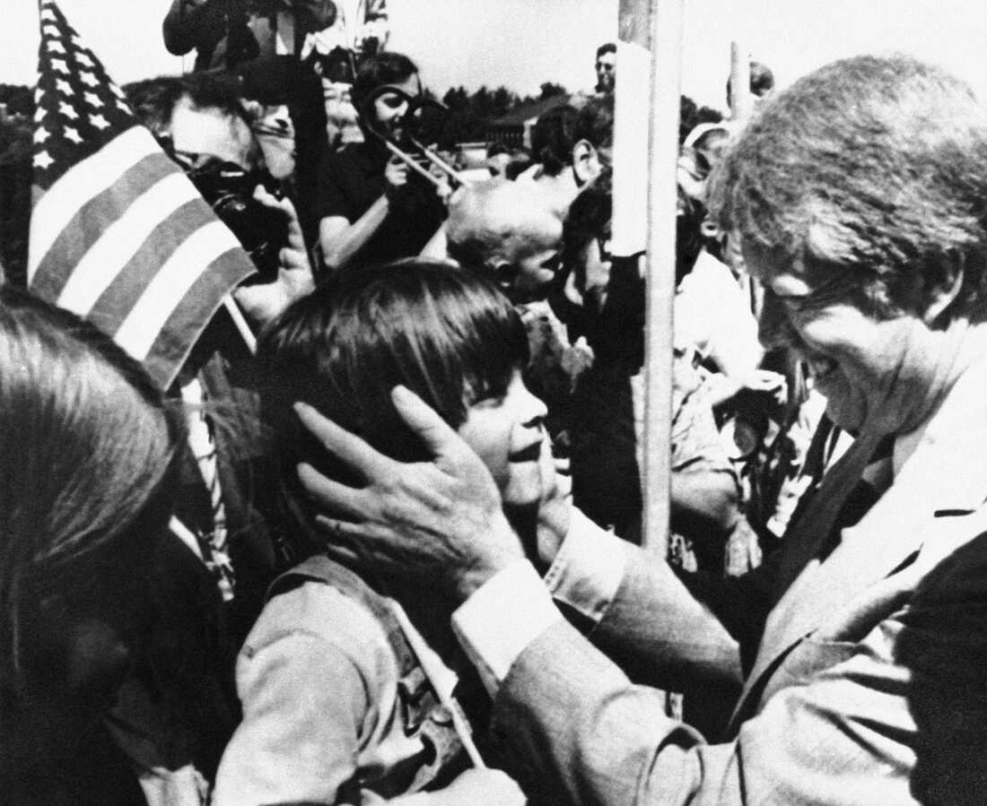 Democratic presidential candidate Jimmy Carter greets a young supporter as he arrives in Manchester, N.H., on Aug. 3, 1976. Carter was in New Hampshire for a rally and fundraising events.