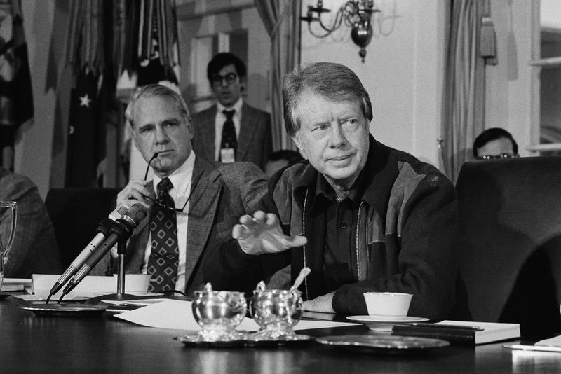 President Jimmy Carter discusses the energy shortage during a special Cabinet meeting in 1977. Next to him is James Schlesinger, who was then his adviser on energy.