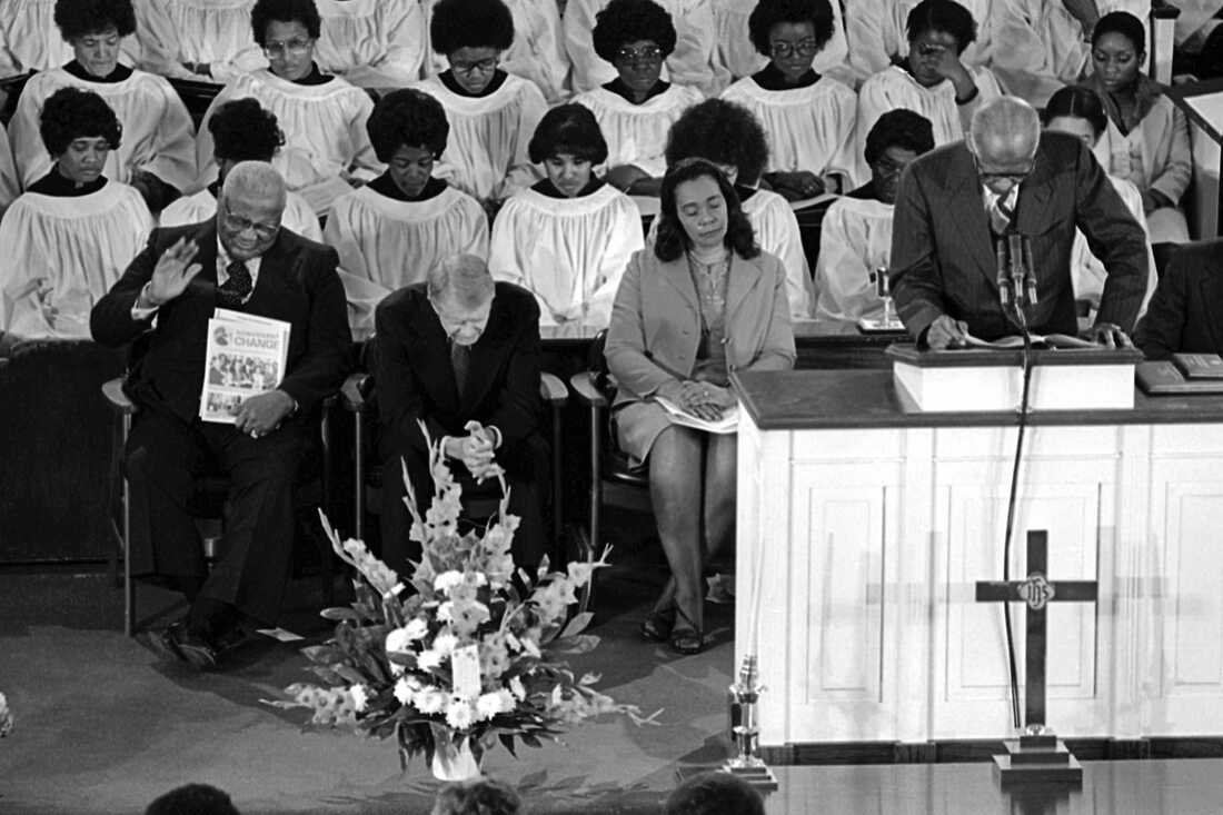 The Rev. Martin Luther King Sr., left, President Carter and Coretta Scott King, the widow of the Rev. Martin Luther King Jr. pray during the convocation at the Ebenezer Baptist Church in Atlanta on Jan. 14, 1979.