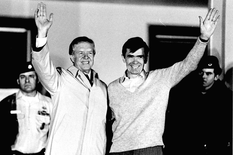 Two days after Carter's successor, Ronald Reagan, was sworn in as president, Carter tearfully greeted 52 former hostages at the U.S. Air Force hospital in Wiesbaden, Germany, after their release from 444 days of captivity in Iran. Here, he waves with former hostage Bruce Laingen, who had been the chargé d'affaires at the U.S. Embassy in Tehran, from the hospital balcony on Jan. 22, 1981.