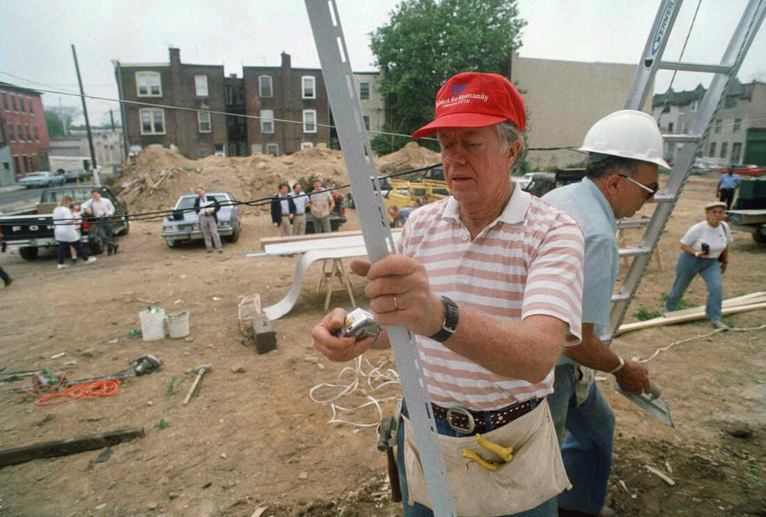 Carter begins construction on homes in Philadelphia on June 20, 1988. Carter and his wife, Rosalynn Carter, were among dozens of Habitat for Humanity volunteers repairing five row houses for low-income residents.