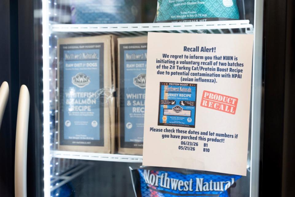 A recall alert is displayed on a refrigerator at a pet store in Tigard, Oregon, last week. A batch of pet food was recalled after it tested positive for the virus (AP Photo/Jenny Kane)