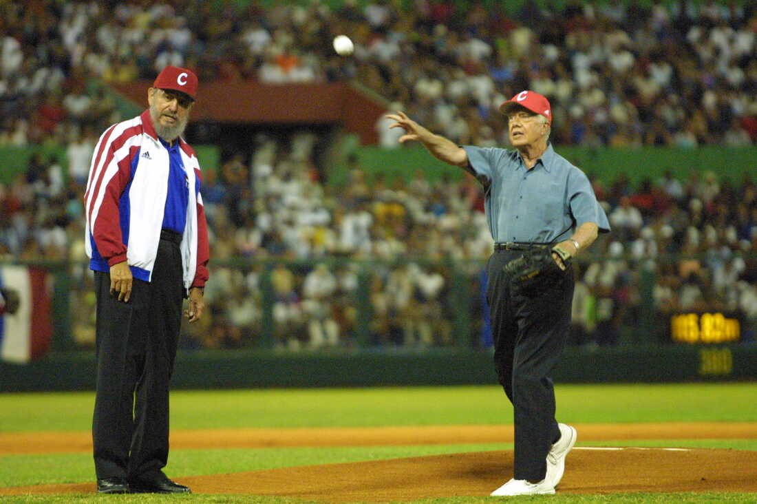 May 14, 2002: Cuban President Fidel Castro watches former US President Jimmy Carter throw a baseball prior to the start of a a friendly baseball match between two Cuban teams in Havana, Cuba. At the time, Carter was the first U.S. President, in or out of office, to visit communist Cuba since the 1959 revolution that put Castro in power.