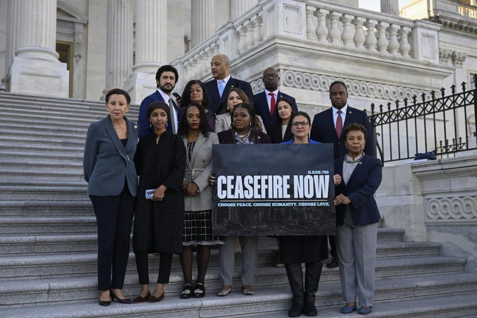 Cori Bush, Rashida Tlaib, Ilhan Omar, AOC, Barbara Lee, and seven other representatives hold a banner calling for a cease-fire on the Capitol steps.