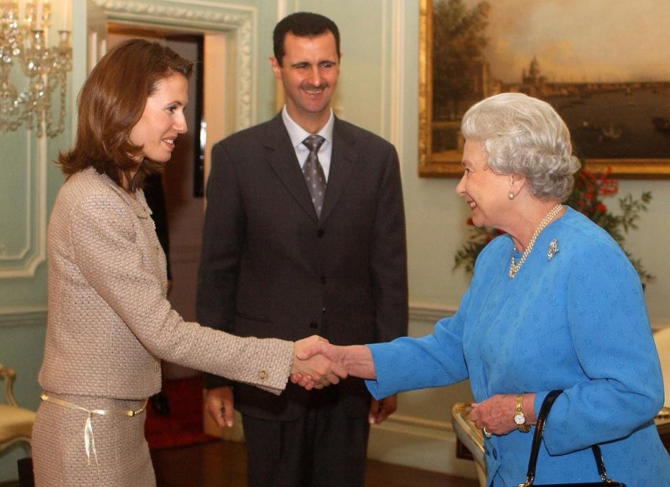 Queen Elizabeth II meeting with then-Syrian president Bashar Assad and his wife Asma in 2002 (PA) (PA Archive)