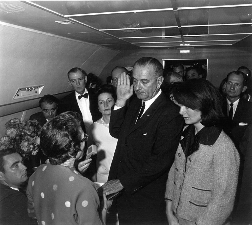 Lyndon B Johnson takes the oath of office as President of the United States, after the assassination of President John F Kennedy on 22 November, 1963. (Getty Images)