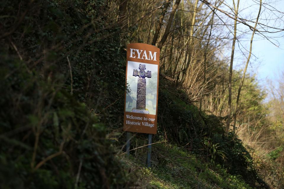 A sign welcomes people to the village of Eyam in Derbyshire, northern England on March 23, 2020. - In the 17th century, the inhabitants of Eyam got rid of the plague by placing themselves in quarantine. In recent more days, in the midst of the novel coronavirus pandemic, this village in central England has seen red in the face of an influx of visitors defying health recommendations. (Photo by Lindsey Parnaby / AFP) / TO GO WITH AFP STORY BY LINDSEY PARNABY AND SYLVAIN PEUCHMAURD (Photo by LINDSEY PARNABY/AFP via Getty Images)