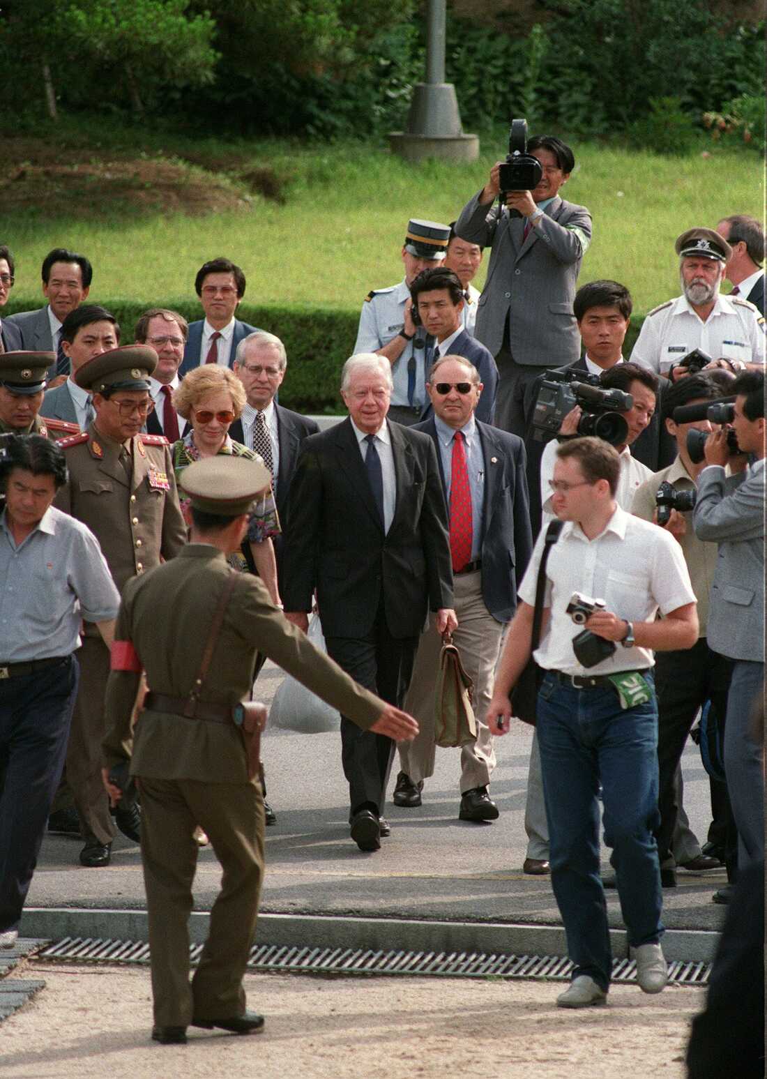 June 18, 1994: North Korean border guard showing a weary-looking former US President Jimmy Carter (C) and his wife Rosalynn (L), the way to the South Korea side of the demilitarized zone (DMZ) as they leave North Korea through Panmunjom border village after Carter's controversial meeting with North Korean President Kim Il-sung.