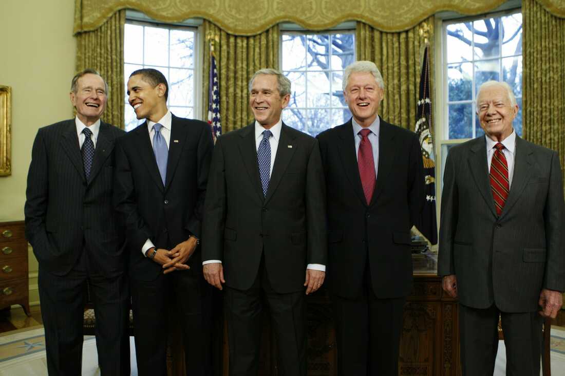 January 7, 2009: President-elect Barack Obama is welcomed by President George W. Bush for a meeting at the White House in Washington, with former presidents, from left, George H.W. Bush, Bill Clinton and Jimmy Carter.