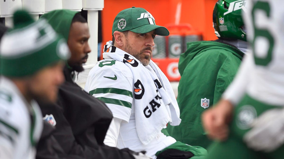 Aaron Rodgers sits on bench