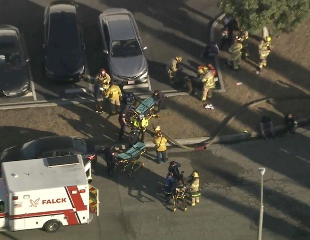 Plane crashes into warehouse near Fullerton airport, catches fire