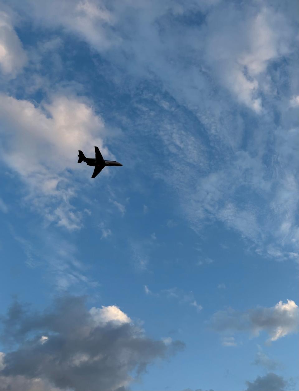 A plane flies out of the Naples Airport Dec. 23, 2024. The public airport, located in the middle of one of the wealthiest cities in the U.S., has been in the same location since 1943 when it was used as a military airfield.