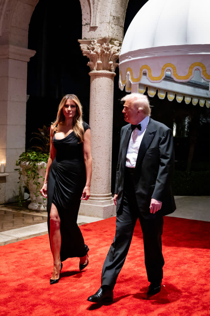 PALM BEACH, FLORIDA - DECEMBER 31:  U.S. President-elect Donald Trump and his wife Melania Trump arrive on New Year's Eve at his Mar-A-Lago Club on December 31, 2024 in Palm Beach, Florida. Trump continues to fill posts in his upcoming administration ahead of his January 20 inauguration. (Photo by Eva Marie Uzcategui/Getty Images)