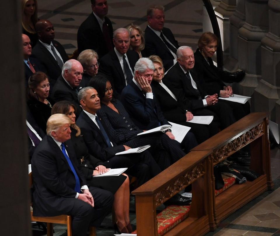 President Donald Trump, first lady Melania Trump, former President Barack Obama, Michelle Obama, former President Bill Clinton, former Secretary of State Hillary Clinton, former President Jimmy Carter and Rosalynn Carter, listen during a State Funeral for former President George H.W. Bush at the Washington National Cathedral, Dec. 5, 2018, in Washington.