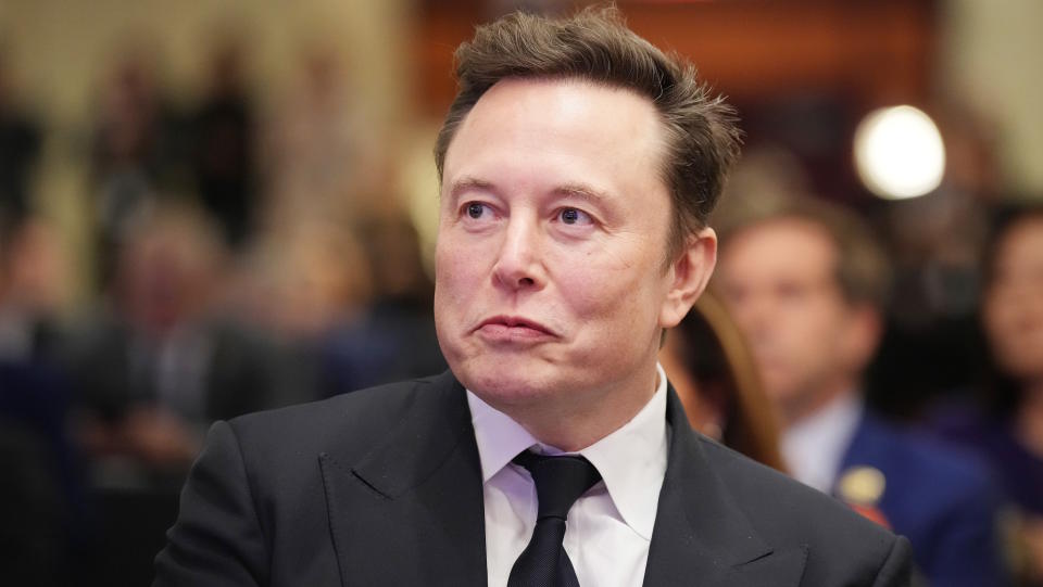  WASHINGTON, DC - NOVEMBER 13: Elon Musk listens as U.S. President-elect Donald Trump addresses a House Republicans Conference meeting at the Hyatt Regency on Capitol Hill on November 13, 2024 in Washington, DC. As is tradition with incoming presidents, Trump is traveling to Washington, DC to meet with U.S. President Joe Biden at the White House as well as meet with Republican congressmen on Capitol Hill. (Photo by Andrew Harnik/Getty Images). 