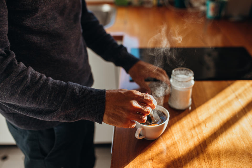 Australian man makes a cup of steaming hot coffee for himself