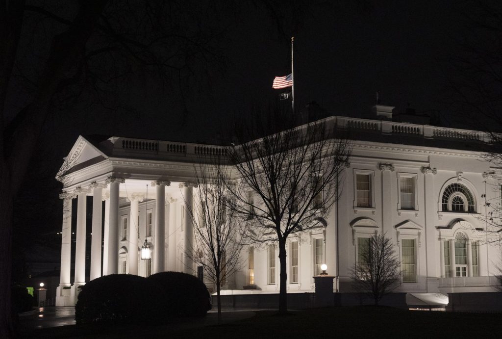 Why are U.S. flags being flown at half-staff on Inauguration Day?