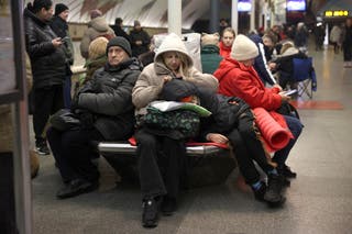 Local residents take shelter in a metro station during an air strike alarm in Kyiv