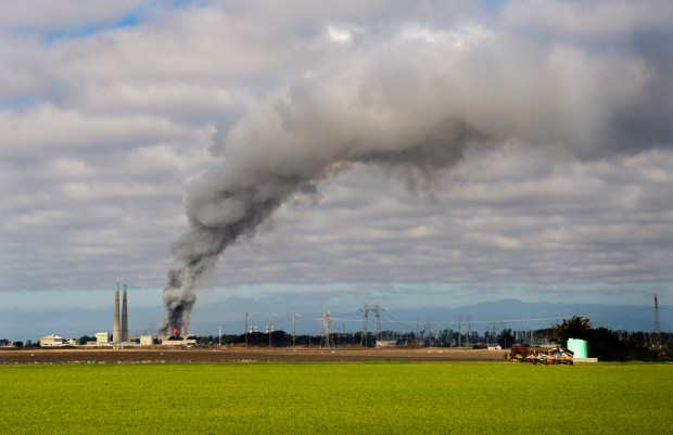 Smoke and flames are seen from Castroville as a fire...