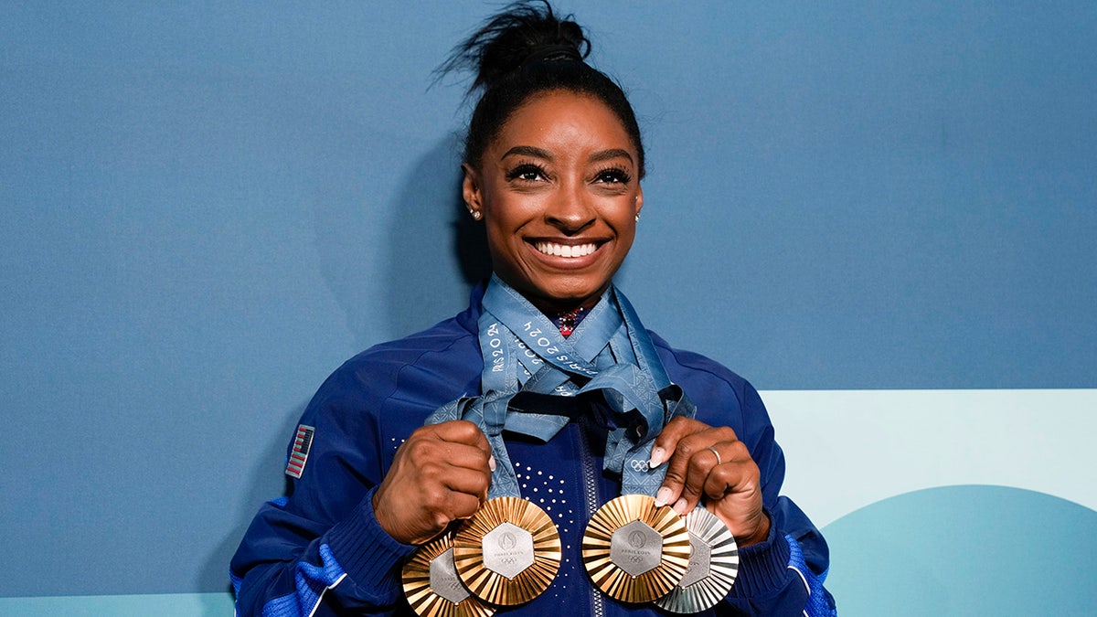 Simone Biles with her medals