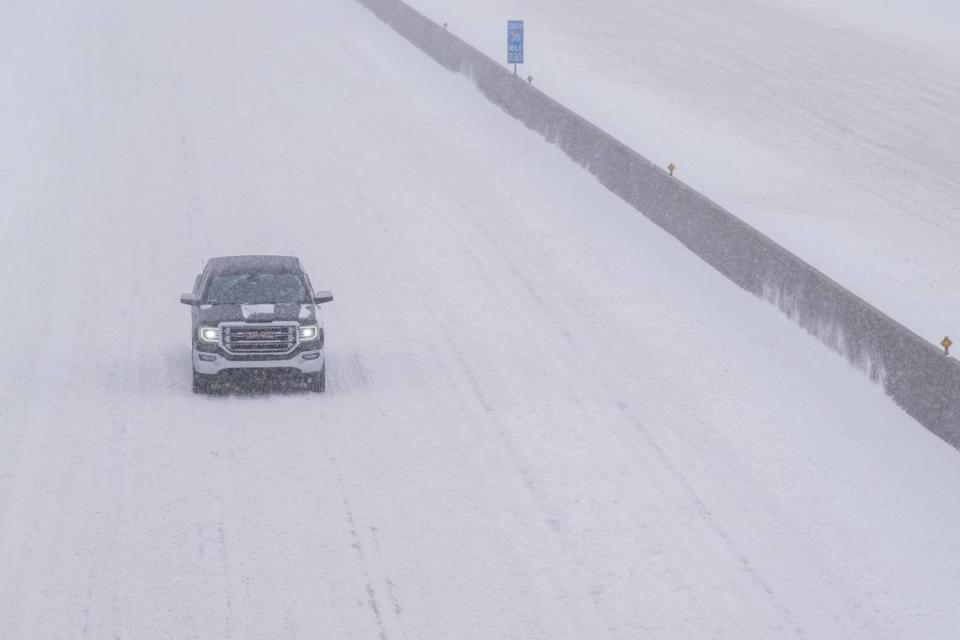 A lone truck drives northbound on a snow packed I-35 on Sunday, Jan. 5.