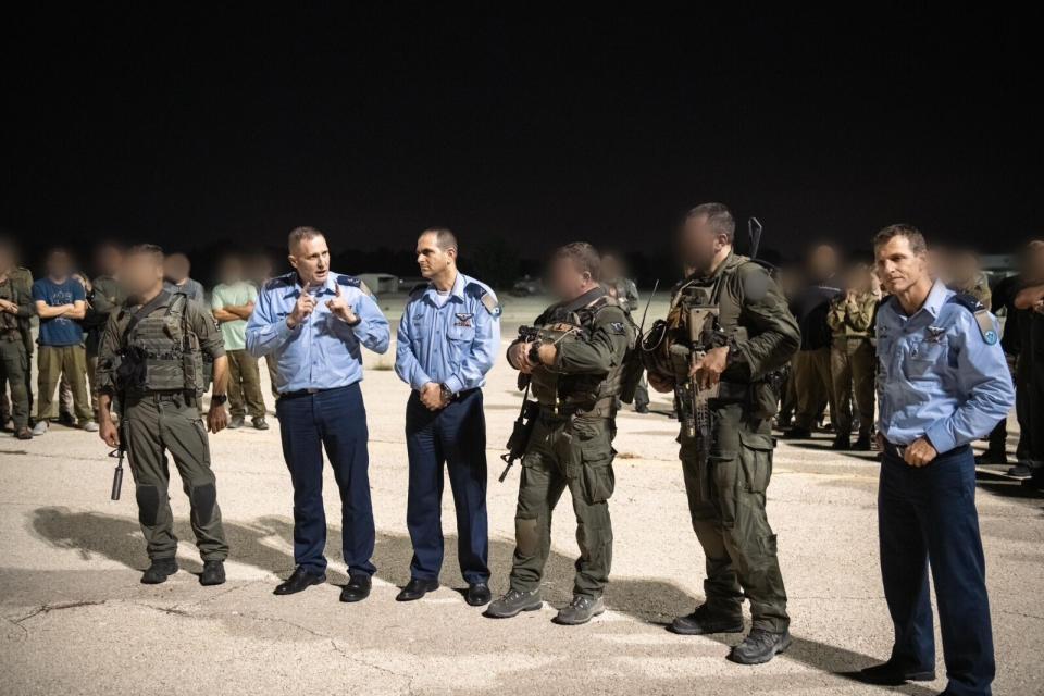 Members of the IAF leadership discuss the outcome of the raid with some of the commandos involved. <em>IDF</em>