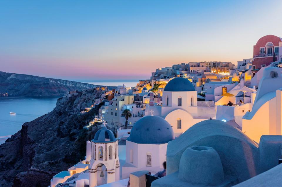 oia, santorini island, cyclades, greece twilight, houses and churches after sunset