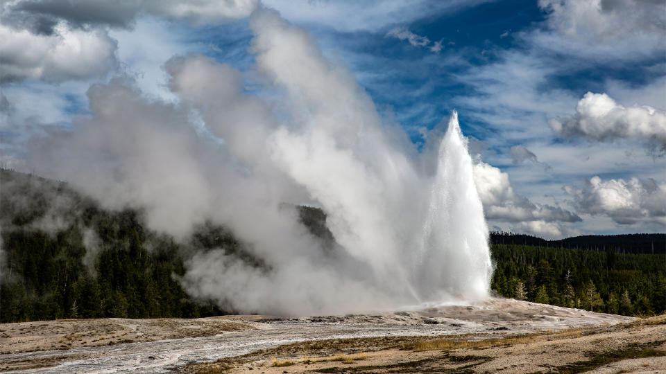 FILE - The iconic Old Faithful Geyser springs to life (every 90 minutes) in Yellowstone National Park&#39;s Upper Geyser Basin on September 18, 2022, in Yellowstone National Park, Wyoming. Sitting atop an active volcanic caldera, Yellowstone, America&#39;s first National Park, is home to more geological hydrothermal features (geysers, mud pots, hot springs, fumaroles) than are found in the rest of the world combined.