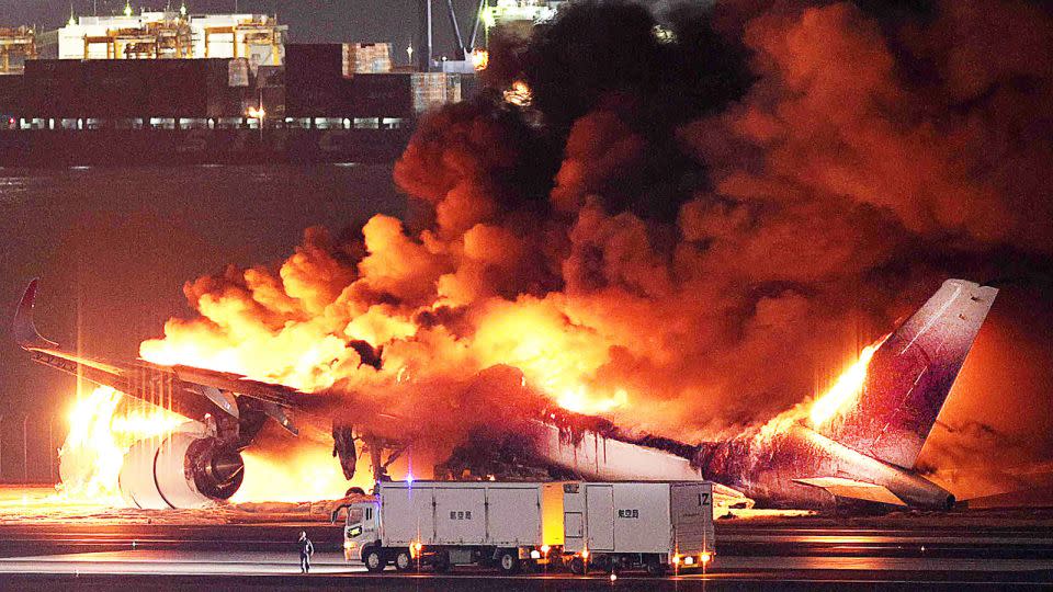 All 379 people onboard Japan Airlines flight 516 survived this crash in January 2024, thanks to the exemplary behavior of crew and passengers. - STR/JIJI PRESS/AFP/Getty Images