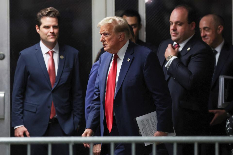 Then-Rep. Matt Gaetz, left, supports former President Donald Trump at his hush money trial in New York City on May 16, 2024.