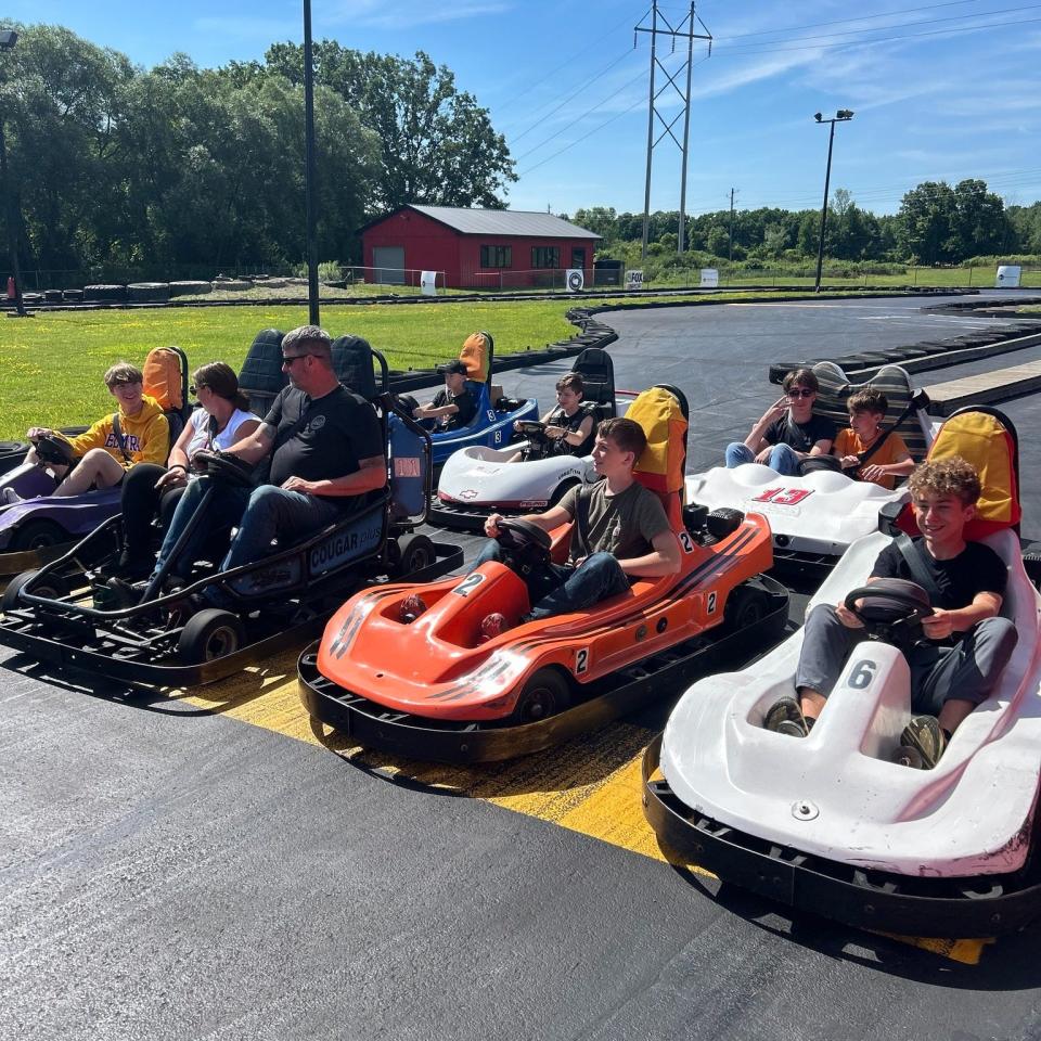 Families rev up at the start line preparing to race go-karts at The Yard FLX, a new business in Watkins Glen.