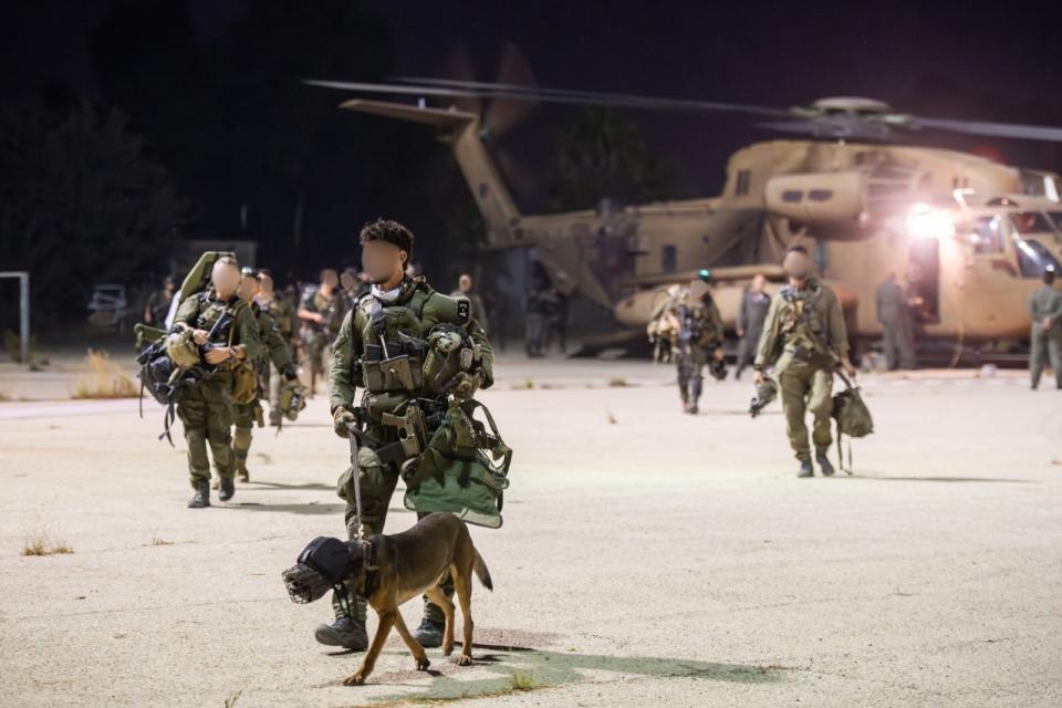 IAF personnel disembark from a CH-53 after the raid. <em>IDF</em>