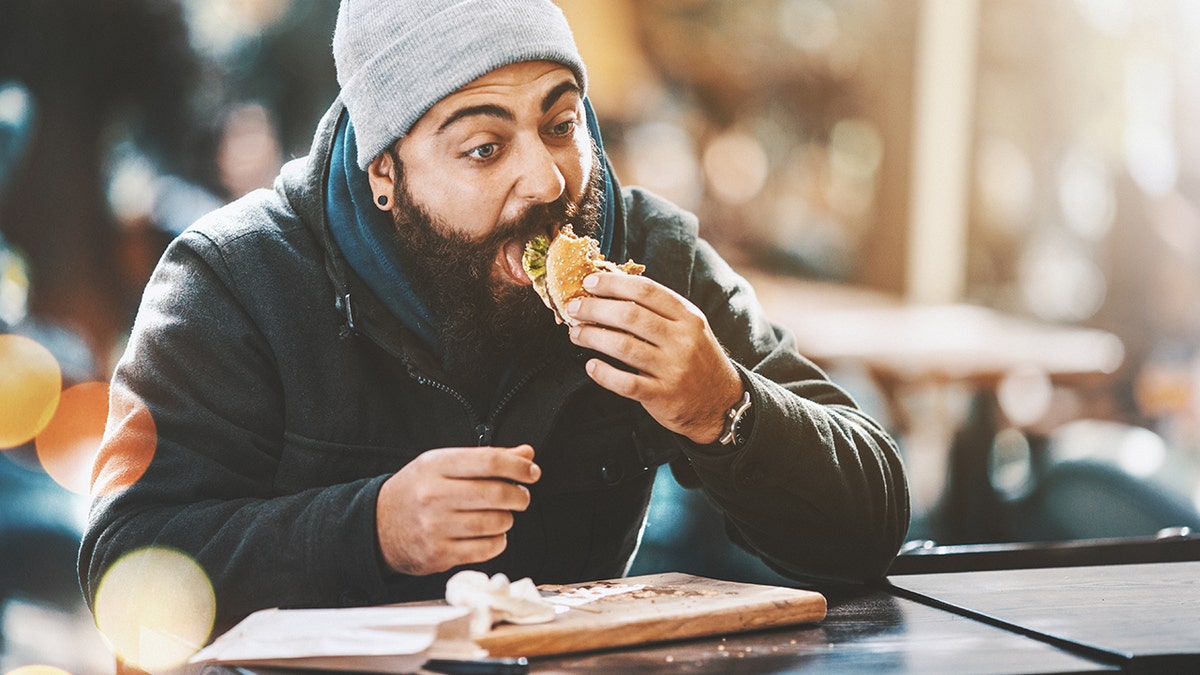 man eating at table