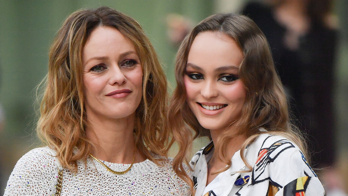 Lily-Rose Depp and mom Vanessa Paradis smile outside