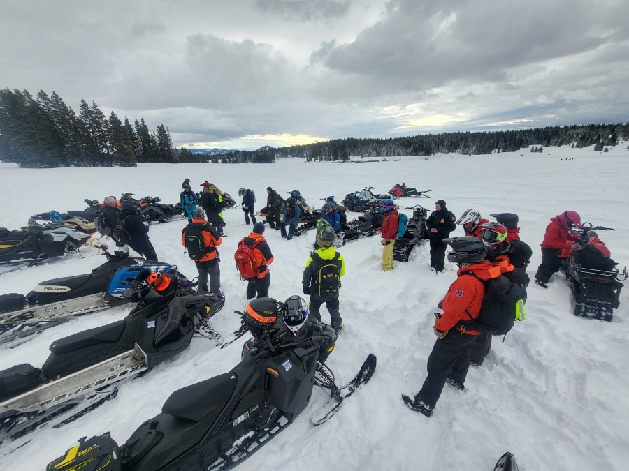Members gather around for briefing during training.